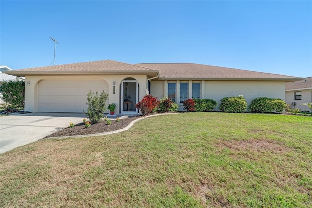 ranch-style home featuring an attached garage, driveway, a front yard, and stucco siding