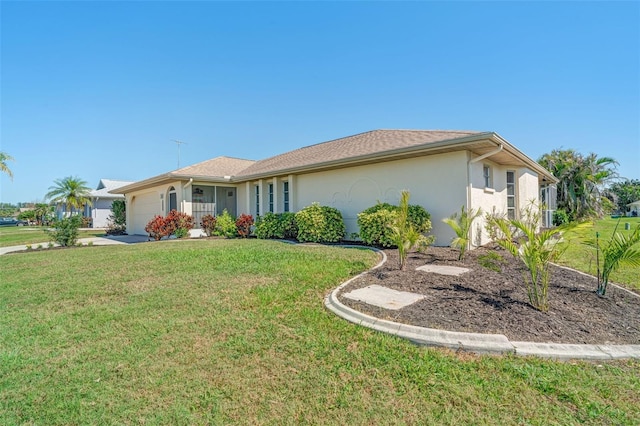 5875 Jackson, Venice, FL 34293 - ranch-style house with a garage, a front lawn, and stucco siding
