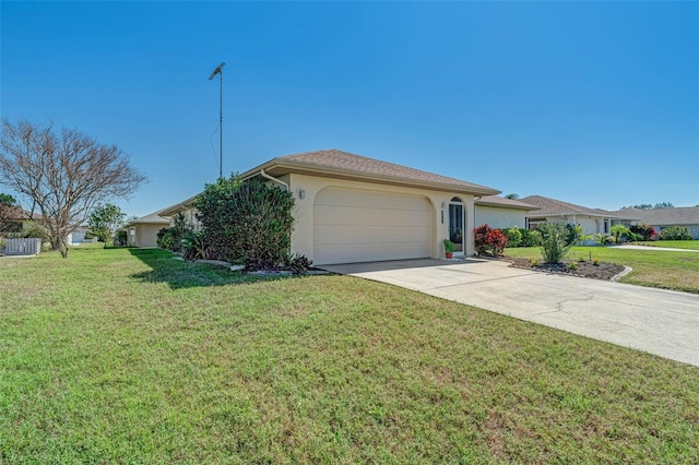 5875 Jackson, Venice, FL 34293 - ranch-style home with a garage, concrete driveway, a front lawn, and stucco siding