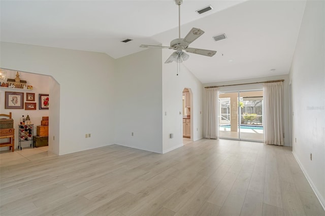 5875 Jackson, Venice, FL 34293 - unfurnished room featuring arched walkways, vaulted ceiling, visible vents, and light wood-style floors