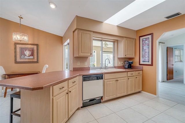 5875 Jackson, Venice, FL 34293 - kitchen featuring visible vents, dishwasher, hanging light fixtures, a peninsula, and a sink
