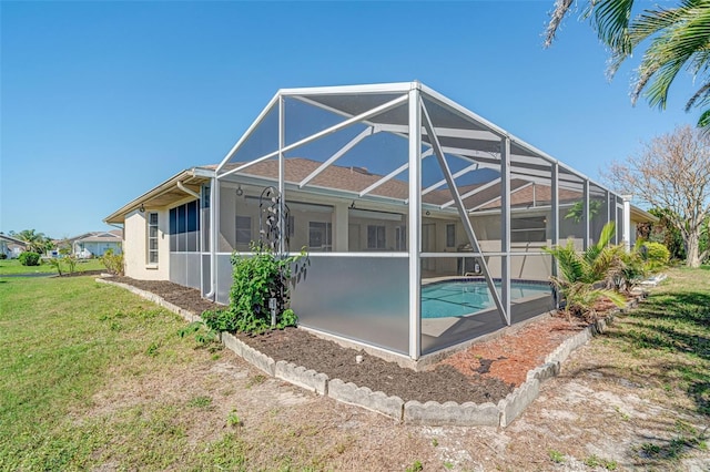 5875 Jackson, Venice, FL 34293 - rear view of house with a yard, a lanai, an outdoor pool, and stucco siding