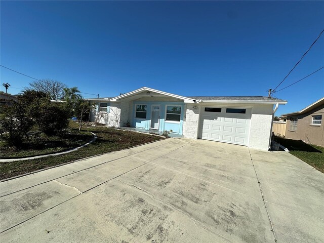 12613 4th Isle, Hudson, FL 34667 - ranch-style home featuring a garage