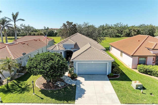 view of front of house featuring a front lawn and a garage