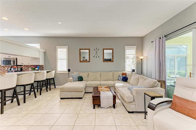 living room with light tile patterned floors