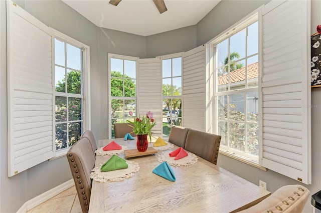 sunroom / solarium featuring ceiling fan