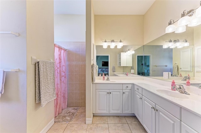 bathroom featuring tile patterned flooring, a shower with shower curtain, and vanity