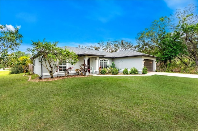 ranch-style house featuring a garage, a front yard, concrete driveway, and stucco siding