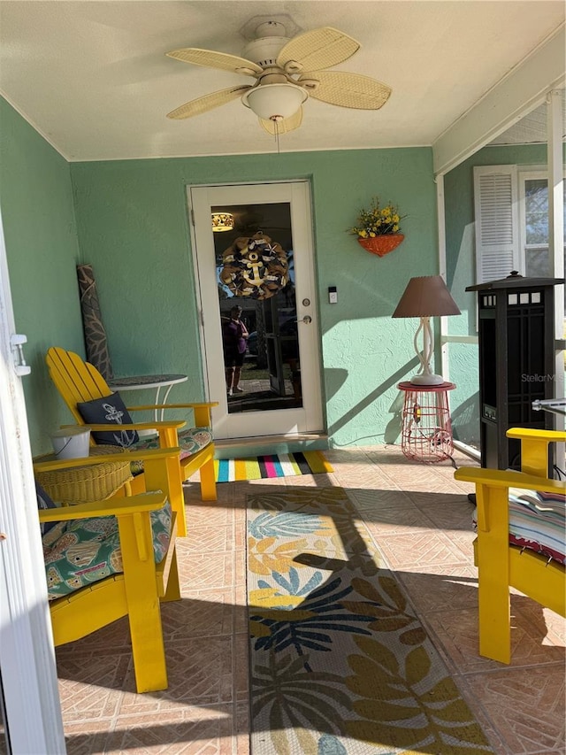 entrance to property with ceiling fan