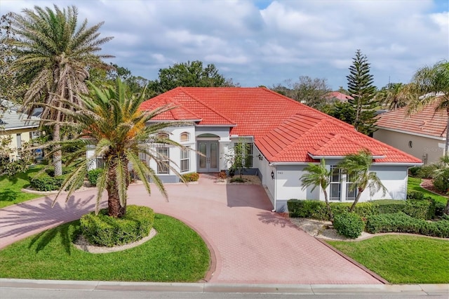 surrounding community featuring decorative driveway