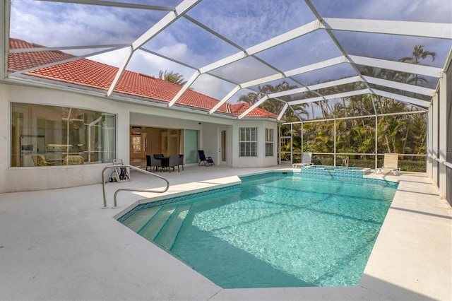 view of swimming pool with a patio area and a pool with connected hot tub