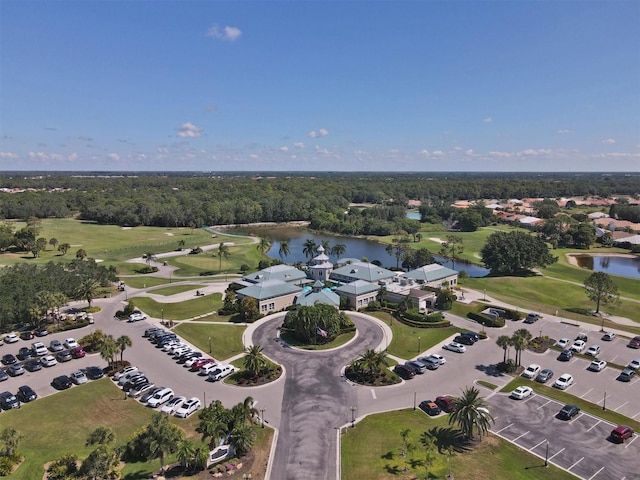 birds eye view of property featuring golf course view and a water view