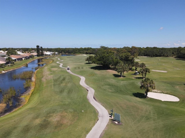 bird's eye view with view of golf course and a water view