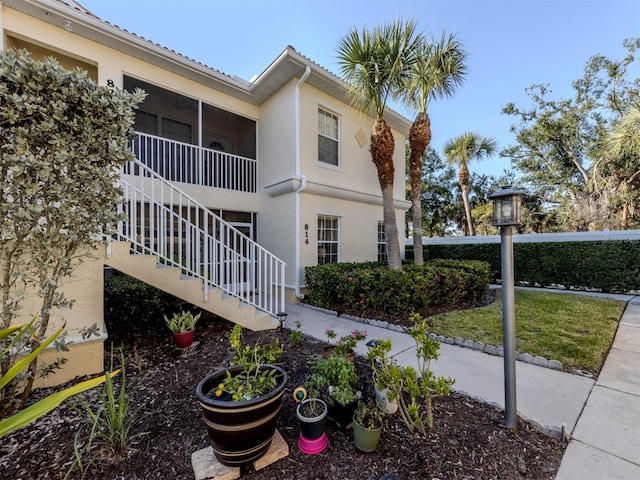 view of property featuring stairway