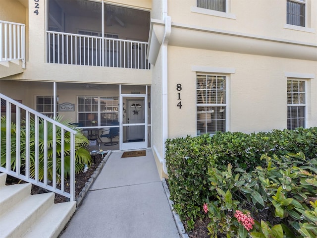 property entrance featuring stucco siding