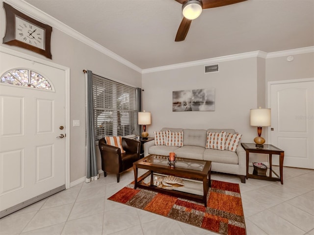 living room featuring light tile patterned floors, visible vents, baseboards, a ceiling fan, and ornamental molding