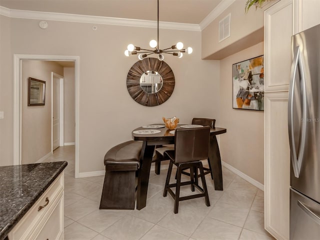 dining area featuring crown molding, light tile patterned floors, visible vents, a chandelier, and baseboards