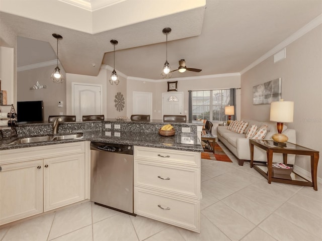 kitchen featuring a sink, open floor plan, dishwasher, dark stone countertops, and decorative light fixtures