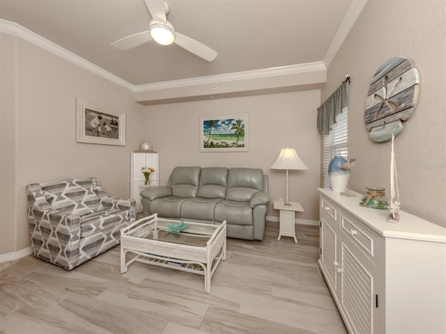 living area featuring baseboards, a ceiling fan, and crown molding