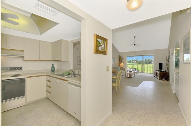 kitchen with white appliances, sink, range hood, ceiling fan, and cream cabinets