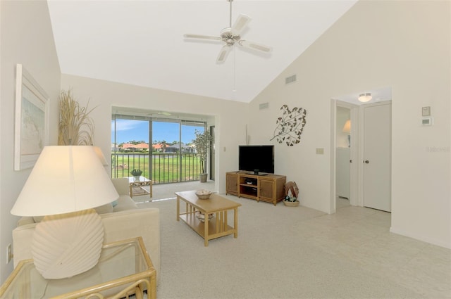 living room featuring ceiling fan and high vaulted ceiling