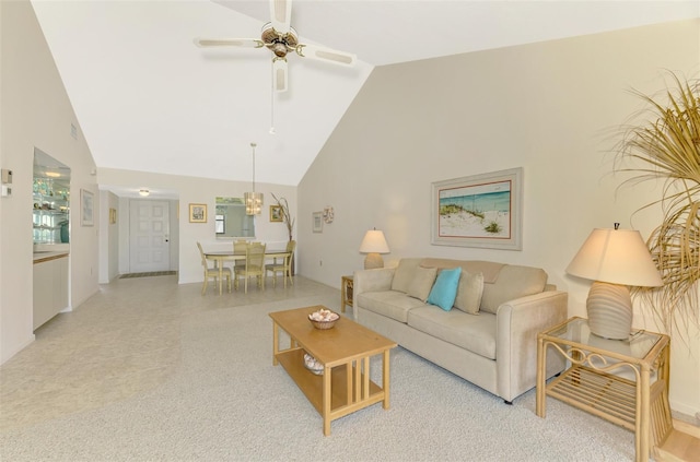 living room featuring ceiling fan and high vaulted ceiling