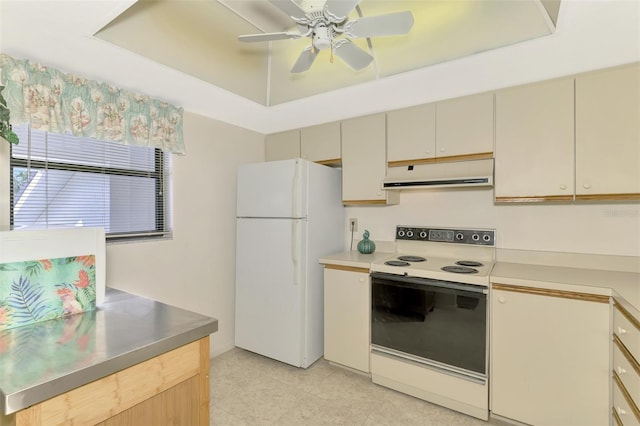 kitchen with ceiling fan, white appliances, and a raised ceiling