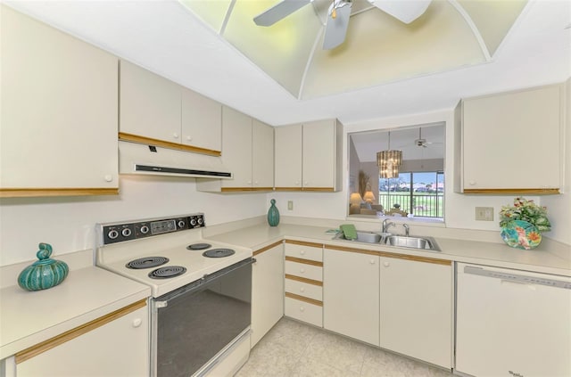 kitchen with sink, white appliances, hanging light fixtures, and ceiling fan