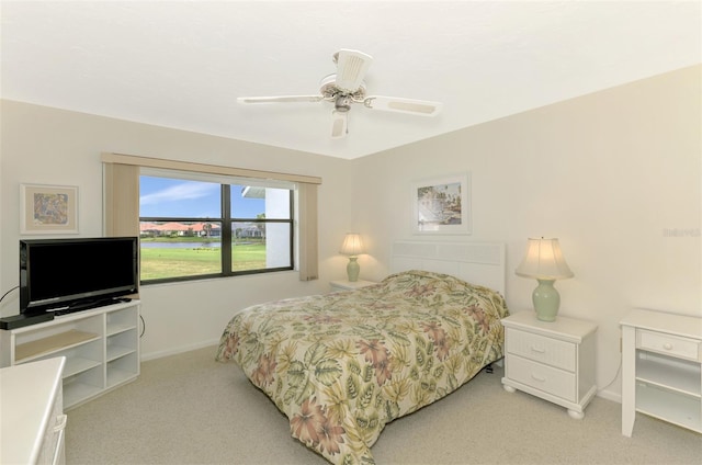 bedroom featuring ceiling fan and light colored carpet