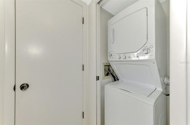 laundry area with stacked washer / drying machine