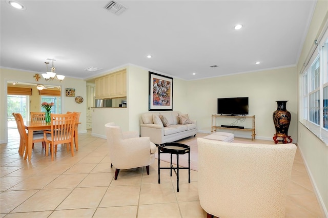 living area with light tile patterned floors, visible vents, a wealth of natural light, and ornamental molding