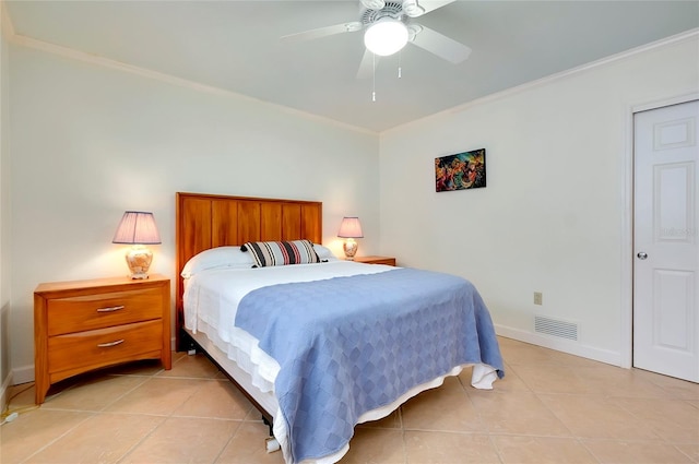 bedroom featuring baseboards, visible vents, a ceiling fan, crown molding, and light tile patterned flooring