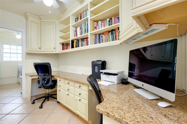 office space featuring ceiling fan, light tile patterned floors, and built in study area