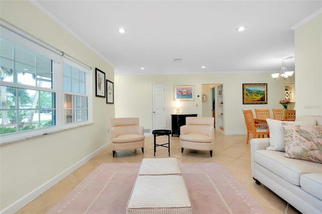 living area featuring an inviting chandelier, baseboards, crown molding, and tile patterned floors