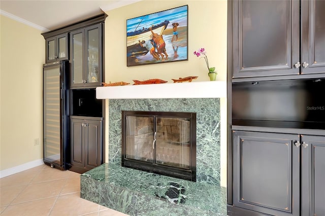 room details featuring refrigerator, ornamental molding, and baseboards