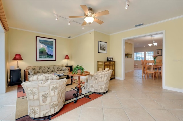 living area featuring light tile patterned floors, baseboards, visible vents, ornamental molding, and track lighting