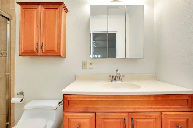 full bathroom with toilet, an enclosed shower, and vanity