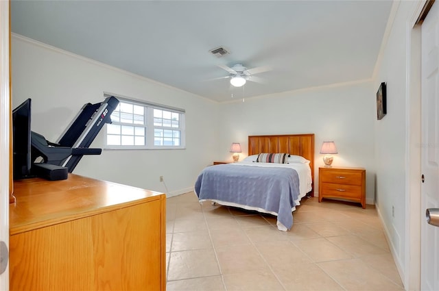 bedroom featuring light tile patterned floors, visible vents, and ornamental molding