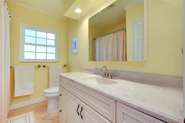 full bathroom featuring toilet, vanity, baseboards, ornamental molding, and tile patterned floors