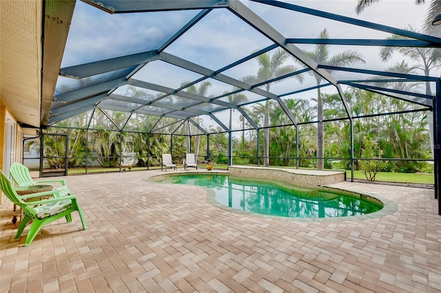 outdoor pool with a patio and a lanai