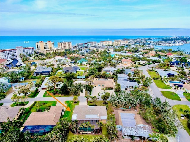 birds eye view of property featuring a view of city and a water view