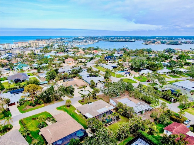 drone / aerial view with a residential view and a water view