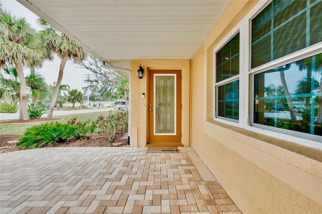 property entrance featuring stucco siding