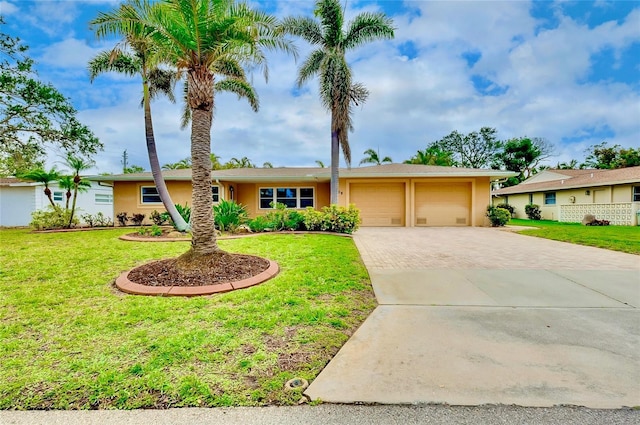 ranch-style house with an attached garage, stucco siding, decorative driveway, and a front yard