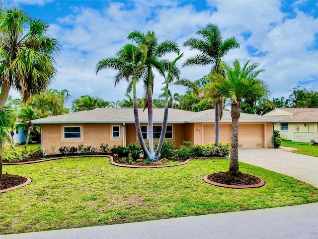 single story home featuring a front yard, driveway, an attached garage, and stucco siding