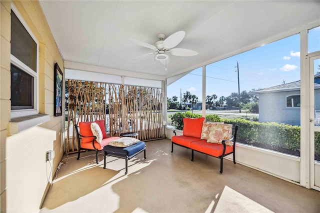 sunroom with ceiling fan