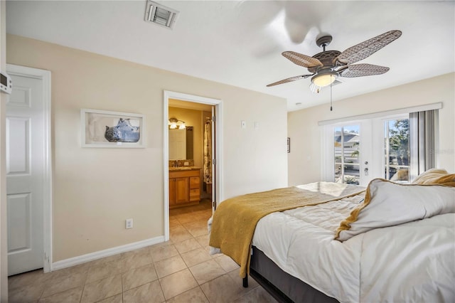 bedroom featuring baseboards, visible vents, connected bathroom, french doors, and light tile patterned flooring