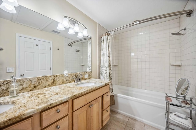 full bath featuring shower / bath combo with shower curtain, visible vents, vanity, and tile patterned floors