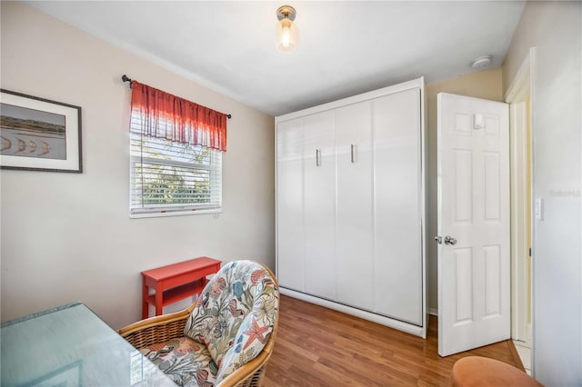 bedroom featuring a closet and wood finished floors