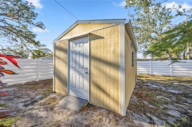 view of shed with a fenced backyard